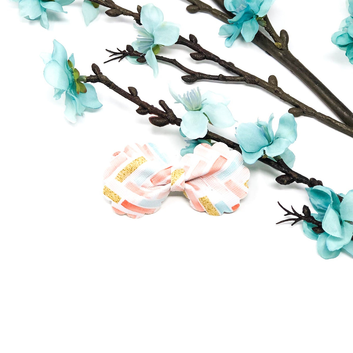 Ruffle Bloom Bow Collection handmade ruffle flower hair bows in coral pink, dusty blue, and spring zigzag pattern
